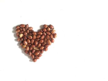 Close-up of heart shape over white background