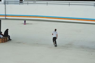 High angle view of man skateboarding in city