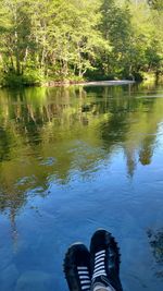 Low section of person by lake