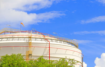 Low angle view of factory against sky