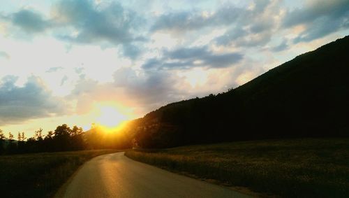 Empty road at sunset