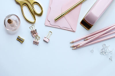 High angle view of personal accessories over white background