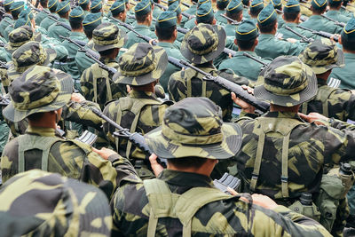 Army soldiers with rifle standing in parade