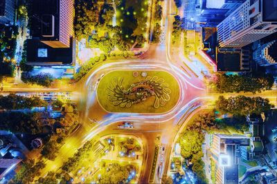 High angle view of city street and buildings at night