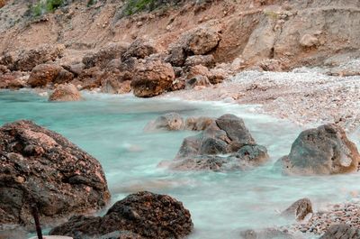 Scenic view of rocks in sea