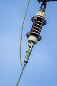 Low angle view of street light against clear blue sky