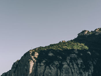 Low angle view of rock formations against sky