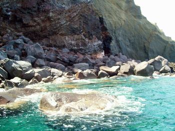 Waves splashing on rocks