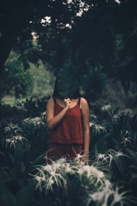 Midsection of woman standing on field