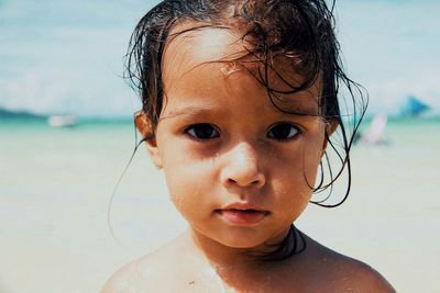 Portrait of cute boy at beach