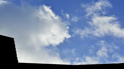 Low angle view of building against blue sky