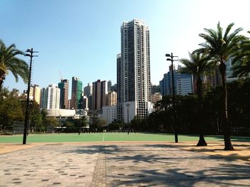 Modern buildings in city against clear sky