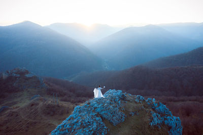 Rear view of man on mountain range