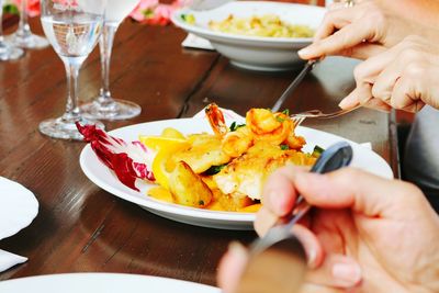 Cropped image of man eating food