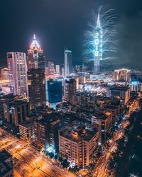 Aerial view of illuminated city at night