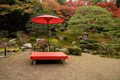 Red table and chairs in park