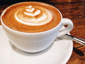 Close-up of cappuccino on table