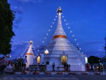 Low angle view of illuminated cathedral against blue sky