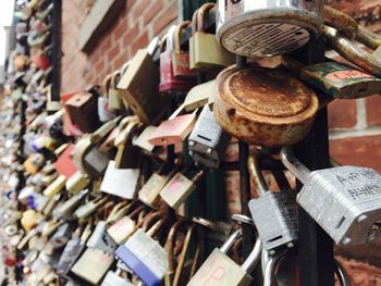 Padlocks hanging on railing