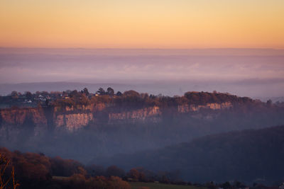 Scenic view of mountains against sky during sunset