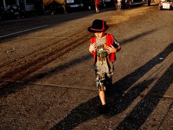 Boy walking on street