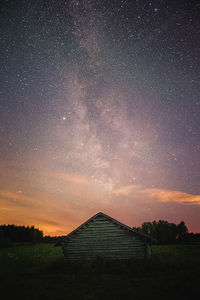 Scenic view of field against sky at night