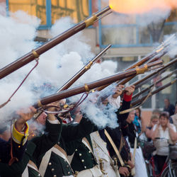 Military performing gun salute during festival