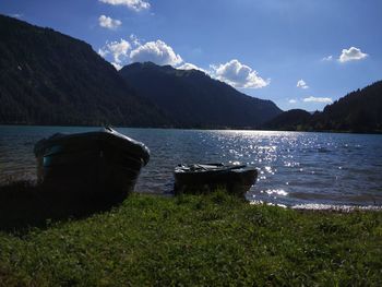 Scenic view of lake and mountains against sky