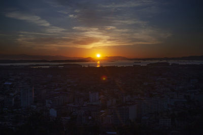 High angle view of buildings against sky during sunset