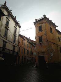 Low angle view of old building against sky