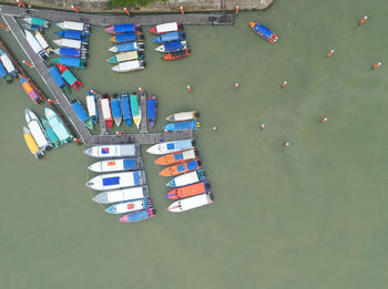 High angle view of multi colored boats moored in water