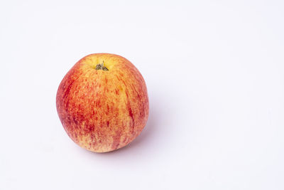 High angle view of apple against white background