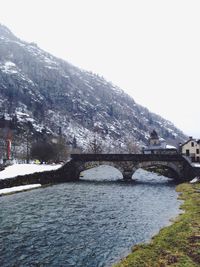 Scenic view of river against cloudy sky