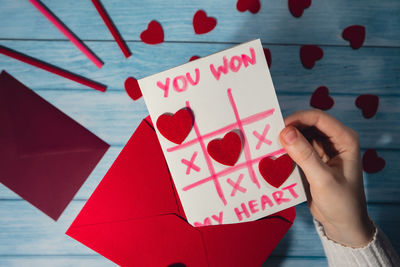 Cropped hand of woman holding gift box