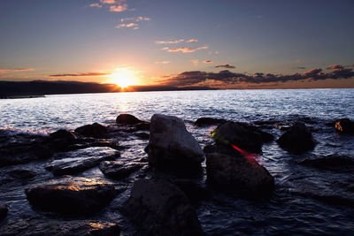 Scenic view of sea against sky during sunset