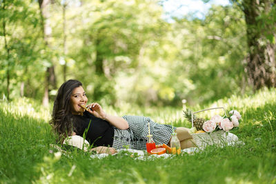 Woman lying on field