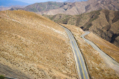 Scenic view of road leading towards mountains