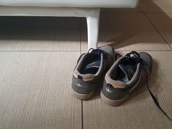 High angle view of shoes on hardwood floor