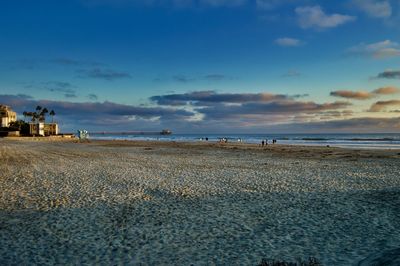 Scenic view of beach against sky during sunset