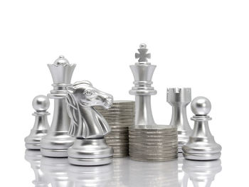 Close-up of chess pieces against white background