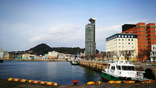 View of boats moored in river