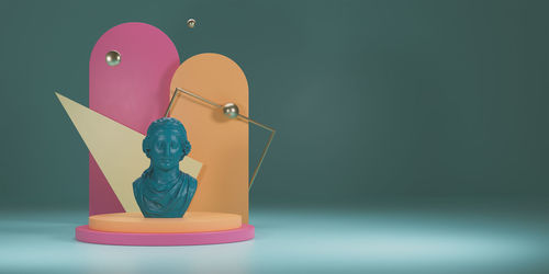 Close-up of toys on table against gray background