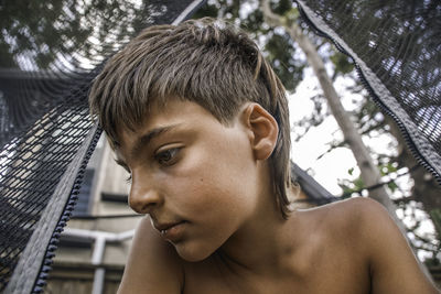 Close-up of young man looking away