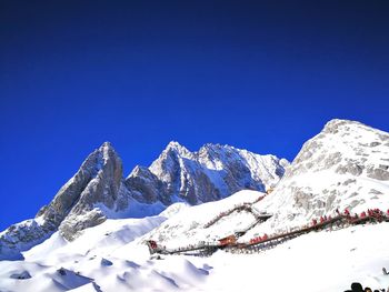 Scenic view of snowcapped mountains against clear blue sky
in jade dragon snow mountain 