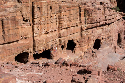 Entrance of a cave, royal tomb in petra, jordan. underground burial place