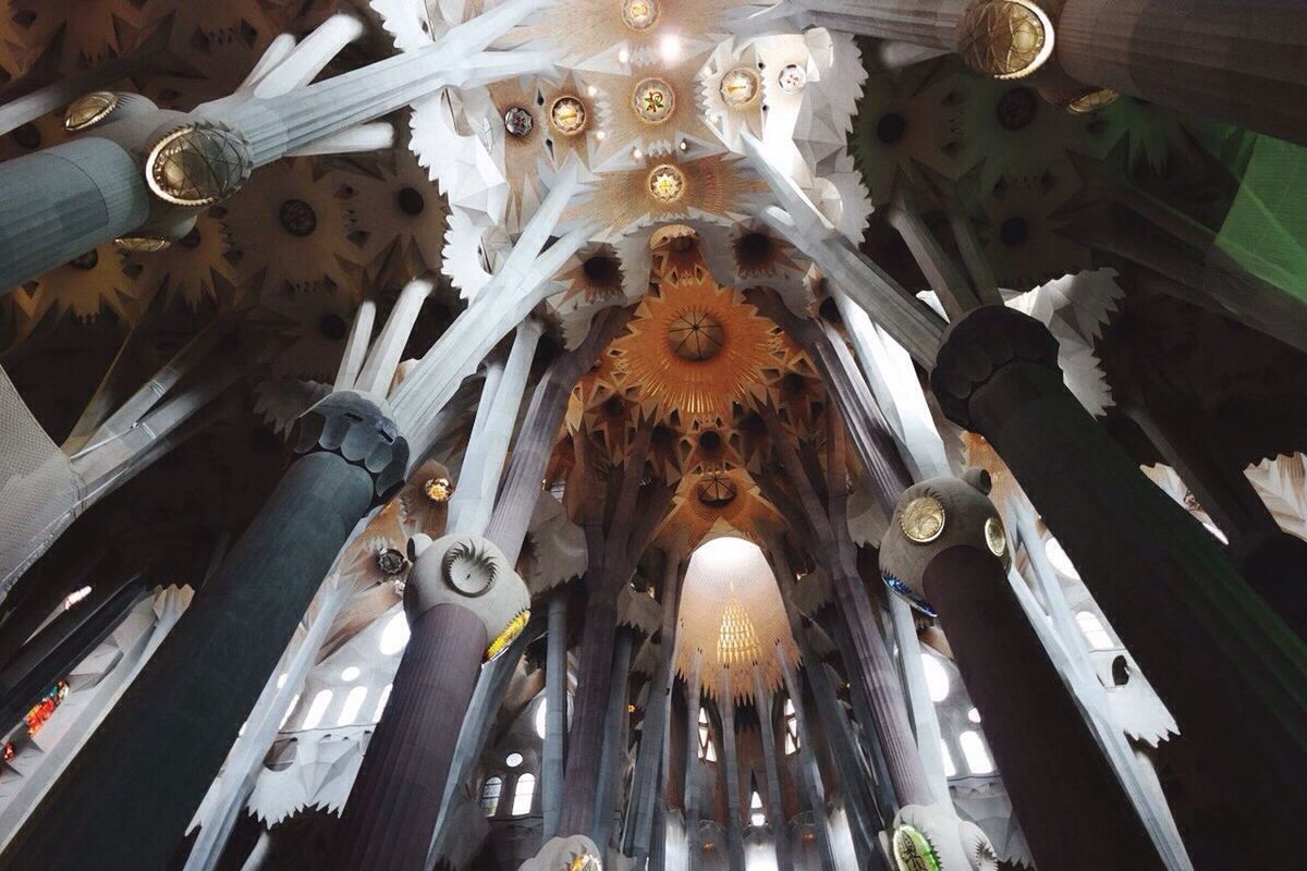 indoors, low angle view, ceiling, illuminated, lighting equipment, built structure, architecture, religion, hanging, spirituality, no people, art and craft, church, place of worship, ornate, architectural feature, art, metal, pattern