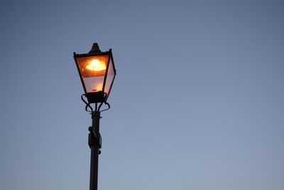 Low angle view of lamp post against clear sky