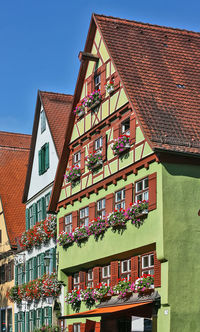 Low angle view of buildings in city against sky