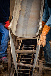 Low section of men working at construction site