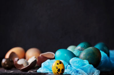Close up of eggs against black background